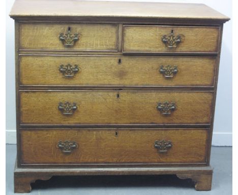 EARLY 19TH CENTURY OAK STRAIGHT FRONTED CHEST of two short and three long cock beaded and cross-banded graduated drawers, on 