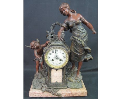 LATE 19TH CENTURY FRENCH BRONZED SPELTER FIGURAL MANTEL CLOCK, the architectural clock with enamel face having Arabic numeral