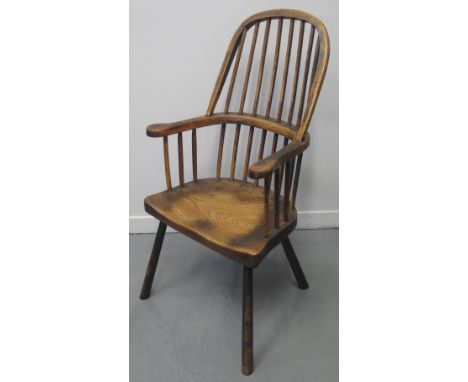 19TH CENTURY ASH, ELM AND BEECH STICK BACKED, FIRESIDE ELBOW CHAIR, with moulded seat and baluster turned legs.(B.P. 24% incl