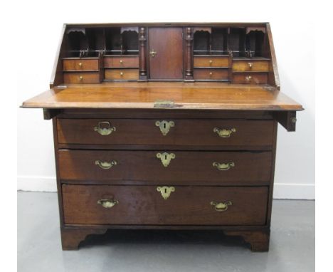 18TH CENTURY MAHOGANY FALL FRONT BUREAU of small proportions, the framed fall revealing stepped interior above three graduate