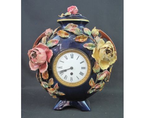 LATE 19TH CENTURY STAFFORDSHIRE MAJOLICA TWO HANDLED FLASK SHAPED CLOCK, the cover and body relief applied with roses and fol