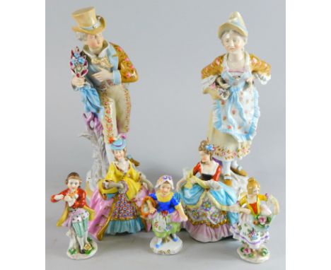 Various Sitzendorf and other porcelain figures, to include boy playing flute, 13cm high, large porcelain figure group of lady