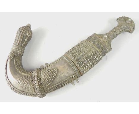 A Middle Eastern jambaya, with white metal scabbard and handle, 37cm long