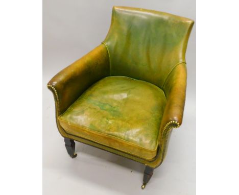 A 19thC mahogany library chair, upholstered in distressed brown leather, with button decoration, on square tapering legs, wit