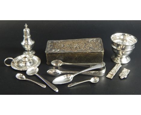 A collection of small silver, to include a miniature candlestick, an egg cup, various spoons, pepper pot etc.