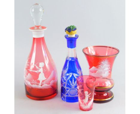 A Mary Gregory style cranberry clear and frosted glass decanter and stopper, 32cm high, a bohemian style blue flash glass dec