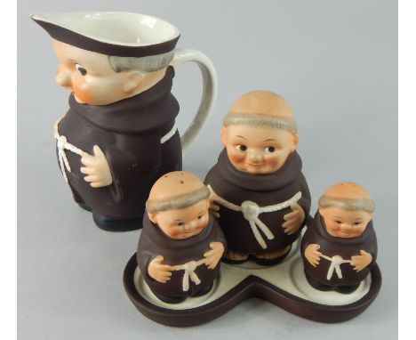 Two items of Goebel porcelain, a cruet and jug, each modelled in the form of monks