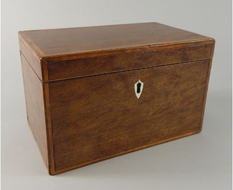 An early 19thC mahogany and satinwood banded tea caddy, the hinged lid enclosing two lidded divisions, 20cm wide