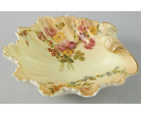 A Royal Worcester porcelain shell shaped dish, painted with flowers, on a bush ivory ground, printed mark to underside in gre