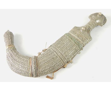 A Middle Eastern jambaya, with white metal handle and scabbard, 42cm long