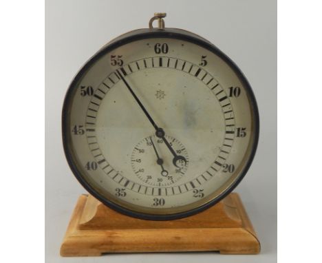 A German Junghans table stopwatch timer, in metal case with later beech stand, the dial 20cm diameter