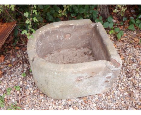 A 19thC bow fronted stone trough