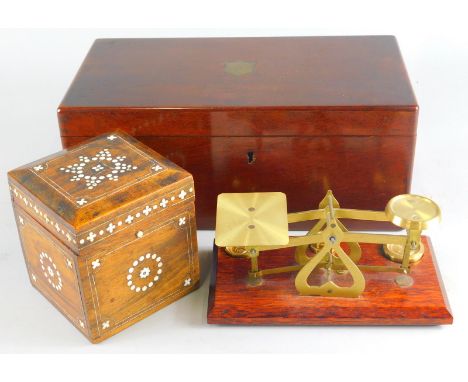 A miniature brass table scale with weights, 18cm high, tea caddy and a single rosewood caddy with ivory style inlay. (3)