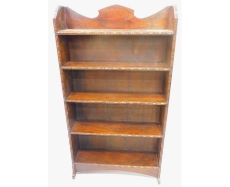 A 1920's oak open bookcase, with bead and reel carving to each shelf, and support.