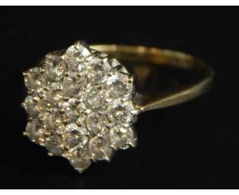 A 9ct gold dress ring, set in a floral cluster, with white stones, 2.3g all in, boxed. 