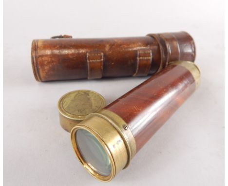 A brass and mahogany three draw telescope by Bate of London, in leather travelling case