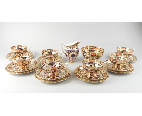 A Royal Crown Derby 4021 pattern Imari part tea service, to include seven cups and saucers, milk jug, saucers, side plates, s