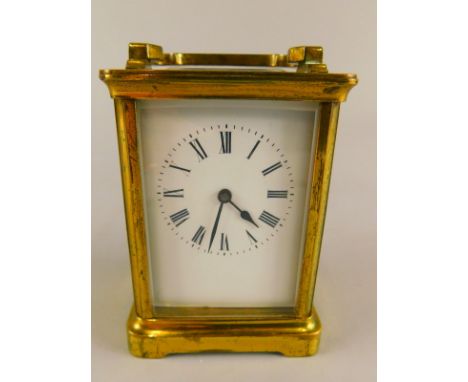 A 20thC French brass carriage timepiece, the enamel dial with Roman numerals, with key, 14.5cm high overall