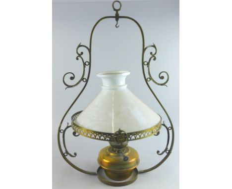 An early 20thC brass hanging lantern, with milk glass shade, of shaped outline, 72cm high.  