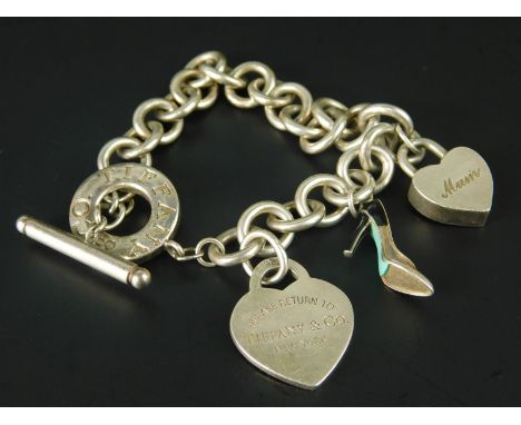 A Tiffany & Co. silver charm bracelet, with Tiffany & Co. mum padlock, Tiffany & Co. Italy enamel shoe (AF) and a Tiffany & C