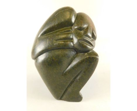 A late 20thC Zimbabwean stone carving by R Mteki, in the form of a crouching figure, 17cm high