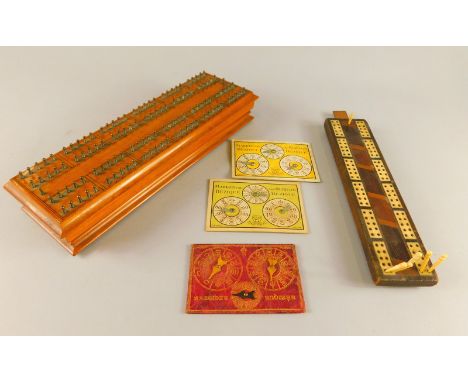 Various games, to include a well crafted walnut cribbage board, with label to underside 'De La Rue & Co London Manufacturers 