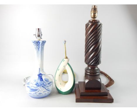 A collection of table lamps, to include a delft style lamp, decorated in blue with a windmill, a Flosmarch example and a turn