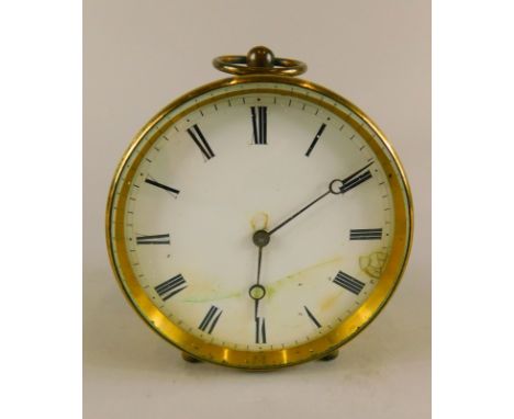 A late 19th/early 20thC French brass travelling timepiece, the circular dial with Roman numerals, stamped to the brass moveme