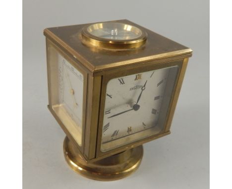 An Angelus brass barometer and mantel timepiece, with four silvered dials, on  a swivel base