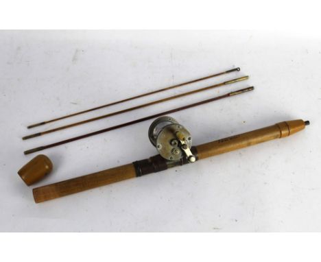 A Shakespeare Model 32 multiplier, fitted on a travel rod in four sections. 167 cm.