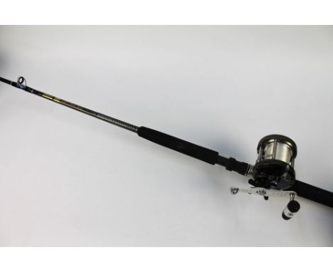 A Shakespeare Ugly Stik smooth boat rod, in one section 1.95 m, fitted with a Shakespeare Quartzlite multiplier.