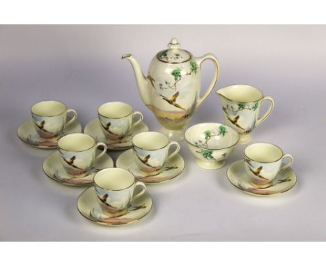 A Royal Doulton Coppice pattern coffee set, with coffee pot, milk, sugar, six cups and saucers, all with pheasant and gilt de