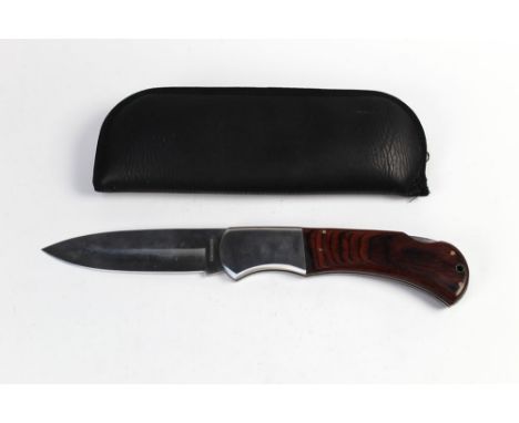 A massive cross cut folding knife, possibly an advertising piece, with a 7 1/2" blade, overall length 43 cm, with leatherette