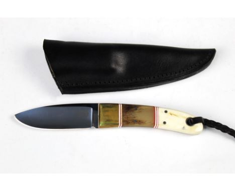 Jakes handmade knife, with a hollow ground blade, 3" and with the handle made from brass Kudu horn and bone.  Overall length 