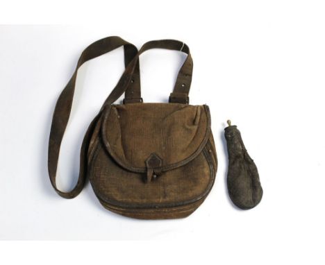 A Bussey & Co London canvas and leather trimmed bag, together with a leather shot flask.