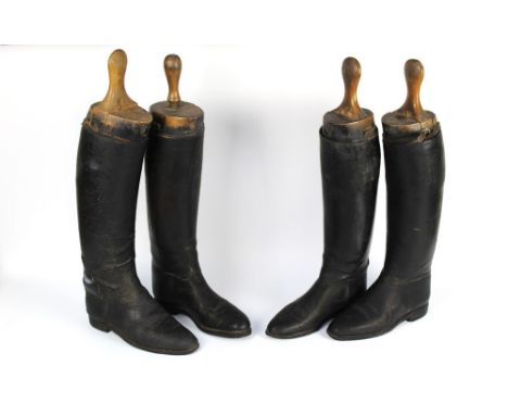 A pair and two single vintage fox hunting leather boots, with wooden shoe trees