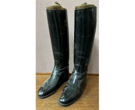 A pair of vintage black leather riding boots, with treen trees