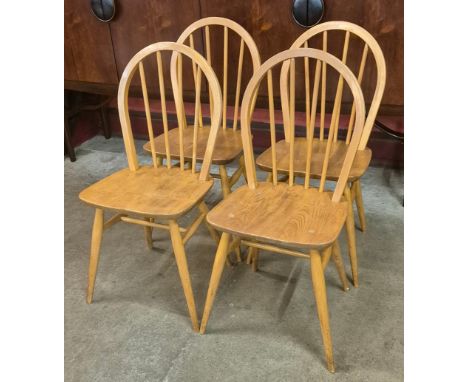 A set of four Ercol Blonde elm and beech Windsor chairs 