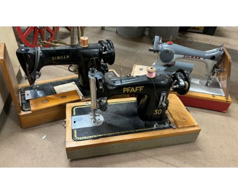 Three vintage cased sewing machines 