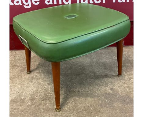 A Sherbourne teak and green leather upholstered pouffe 