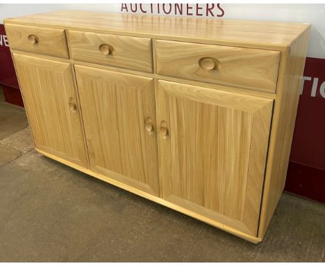 An Ercol Blonde ash Windsor sideboard 