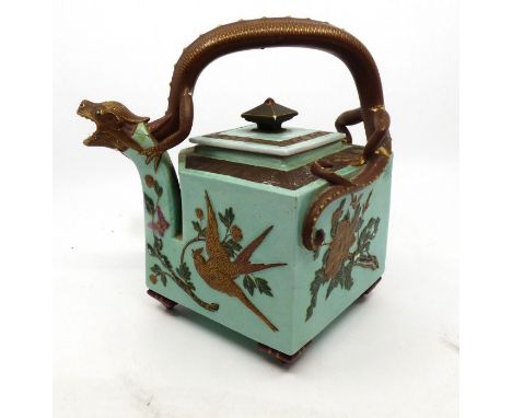 A late Victorian Aesthetic cube teapot, light green ground with birds including golden crane swooping amongst foliage, chilli
