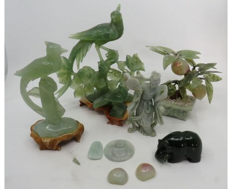 A group of modern jade to include birds in a tree, a bird, a figure , a tree and a bear with a fish