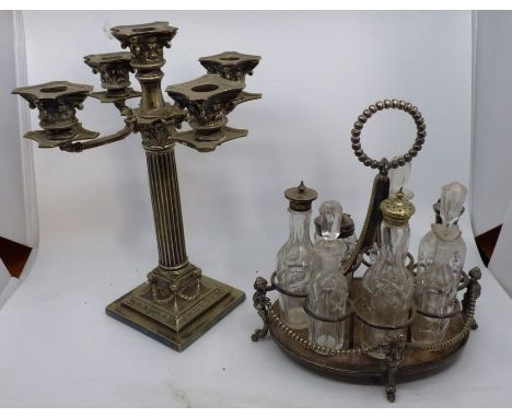 A seven piece Cruet on silver plated stand with top handle and supports, together with a plated five-branch corinthian column