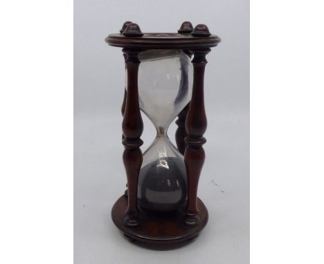 A mid 19th Century mahogany framed desk timer, circa 1860, turned supports and ends, height 18cm (times approximately 33 minu