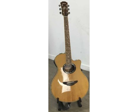 YAMAHA APX 700 NT ELECTRIC ACOUSTIC GUITAR, natural finish, with hard caseguitar 102cm longCondition generally good. Light we