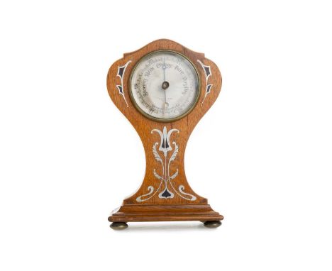 ART NOUVEAU OAK BAROMETER, EDWARD & SONS OF GLASGOW, CIRCA 1910 with silvered dial, the case of waisted form, with stylised w