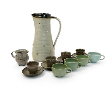 David Leach OBE (1911-2005) a tin-glaze jug and four coffee cans and saucers, four Lowerdown Pottery porcelain tea cups by Da