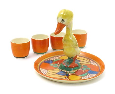 'Melon' a Clarice Cliff Duck egg cruet set, comprising tray, painted in colours inside orange band, and four Bizarre egg cups