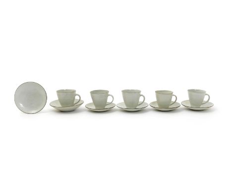 ‡ Dame Lucie Rie DBE (1902-1995) and Hans Coper (1920-1981) a set of five  tea cups and six saucers, each covered in an off w